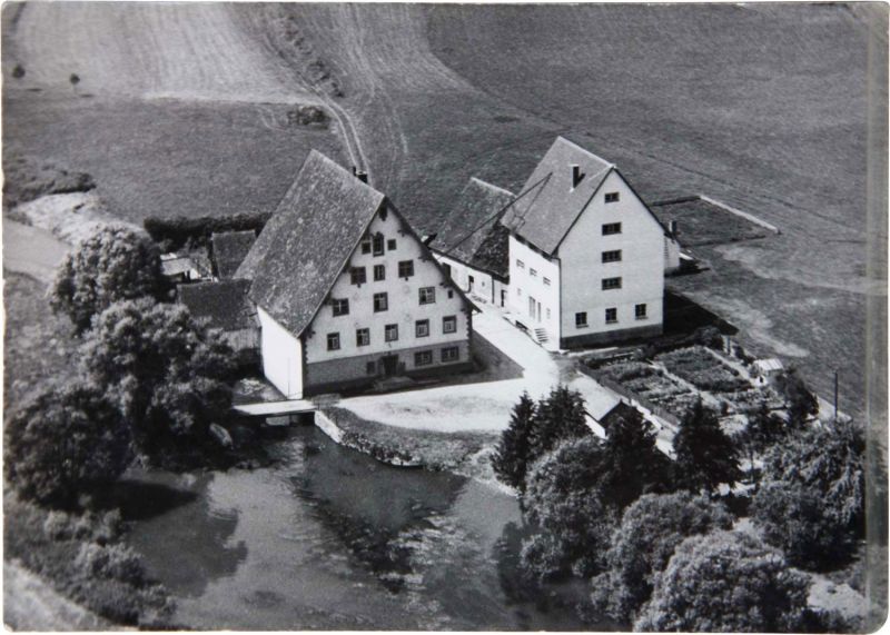 Aerial view of the mill estate by the water before the fire